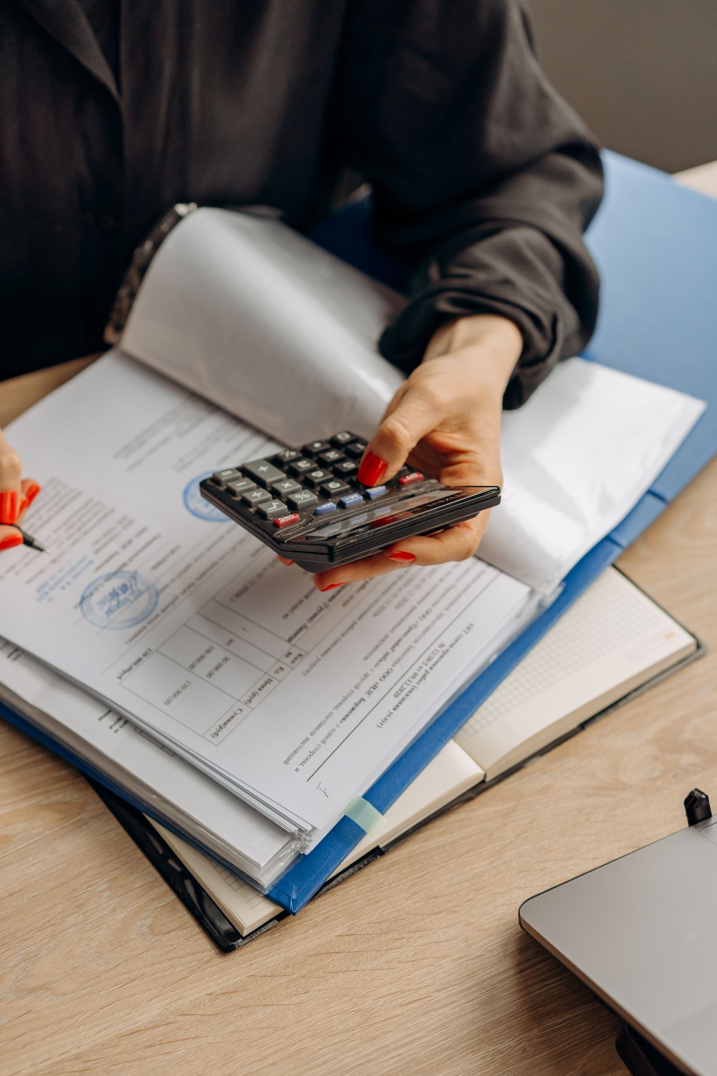 Checking documents with a calculator before a financial transaction